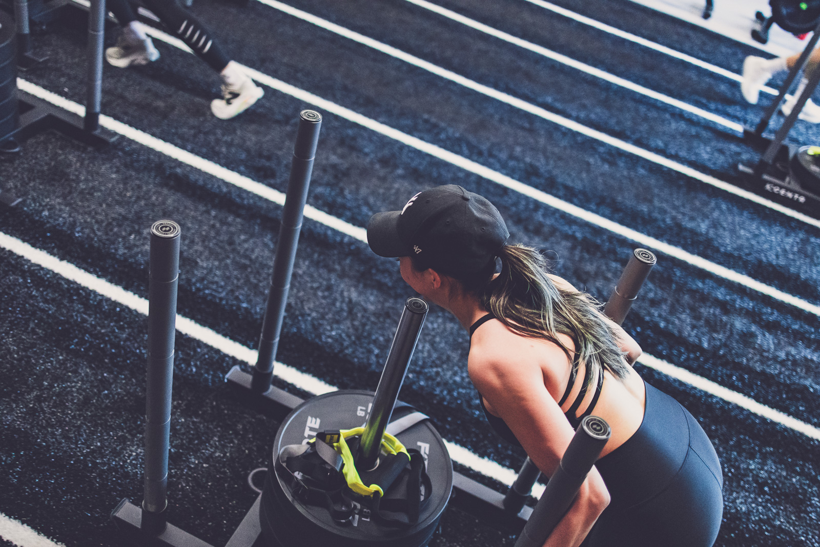 Athlete on sled push at Impact House